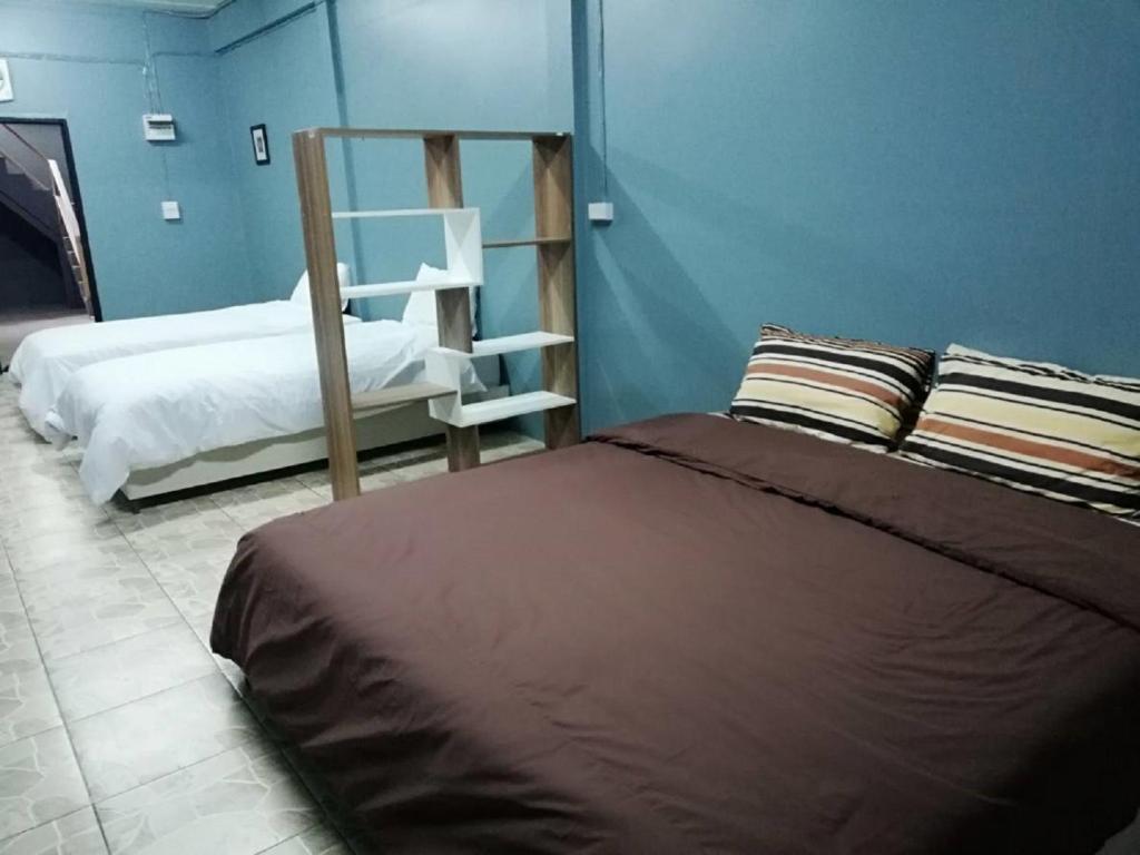Postel nebo postele na pokoji v ubytování E2S Place