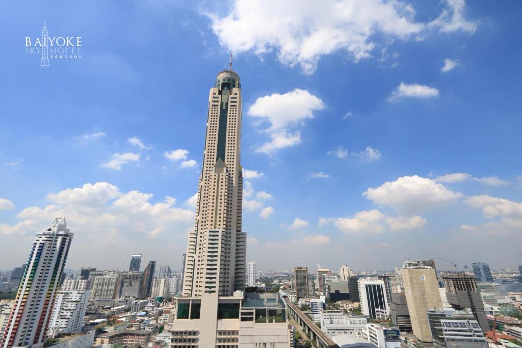 
a tall building with a clock on top at Baiyoke Sky Hotel in Bangkok
