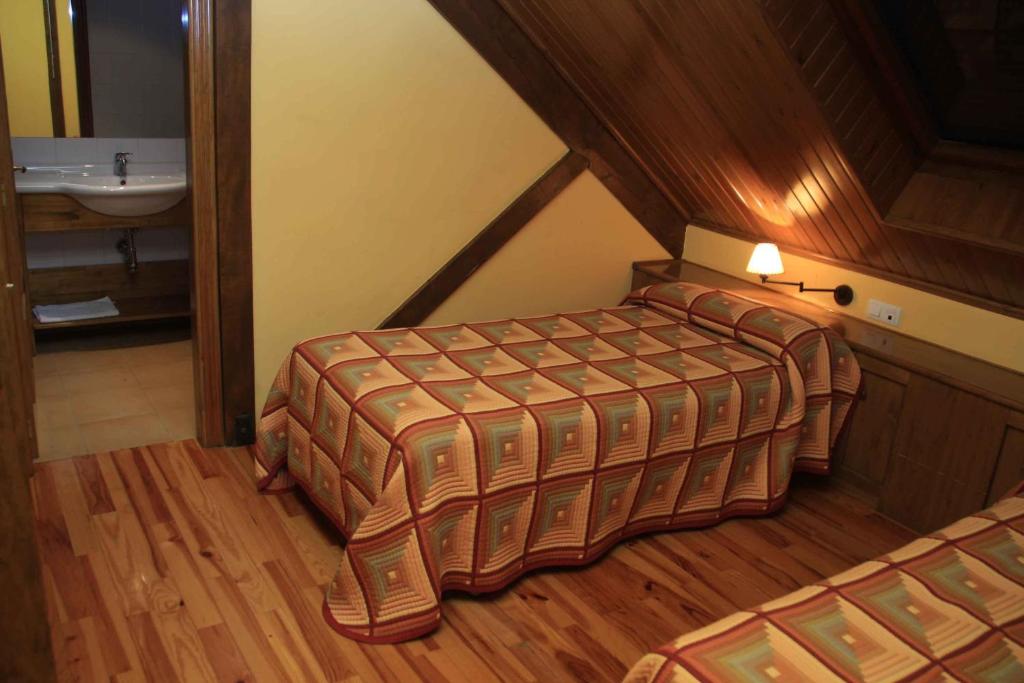 Postel nebo postele na pokoji v ubytování Hotel, Bungalows y Camping Viu