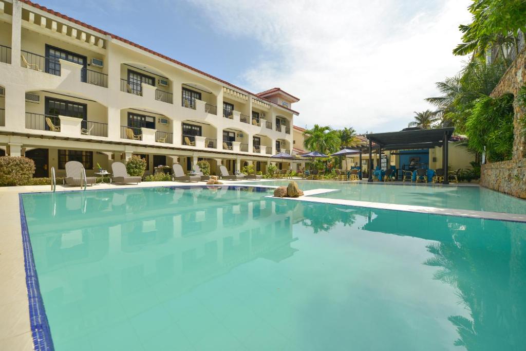 a large swimming pool in front of a building at Le Soleil de Boracay Hotel in Boracay