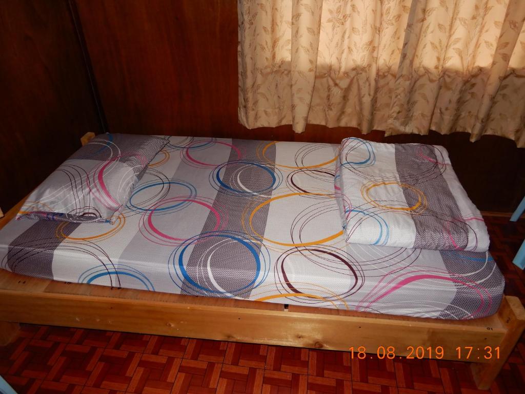 Postel nebo postele na pokoji v ubytování Bulan And Daud Homestay