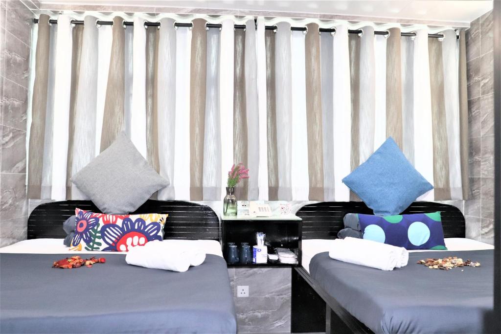 Postel nebo postele na pokoji v ubytování W's Lounge