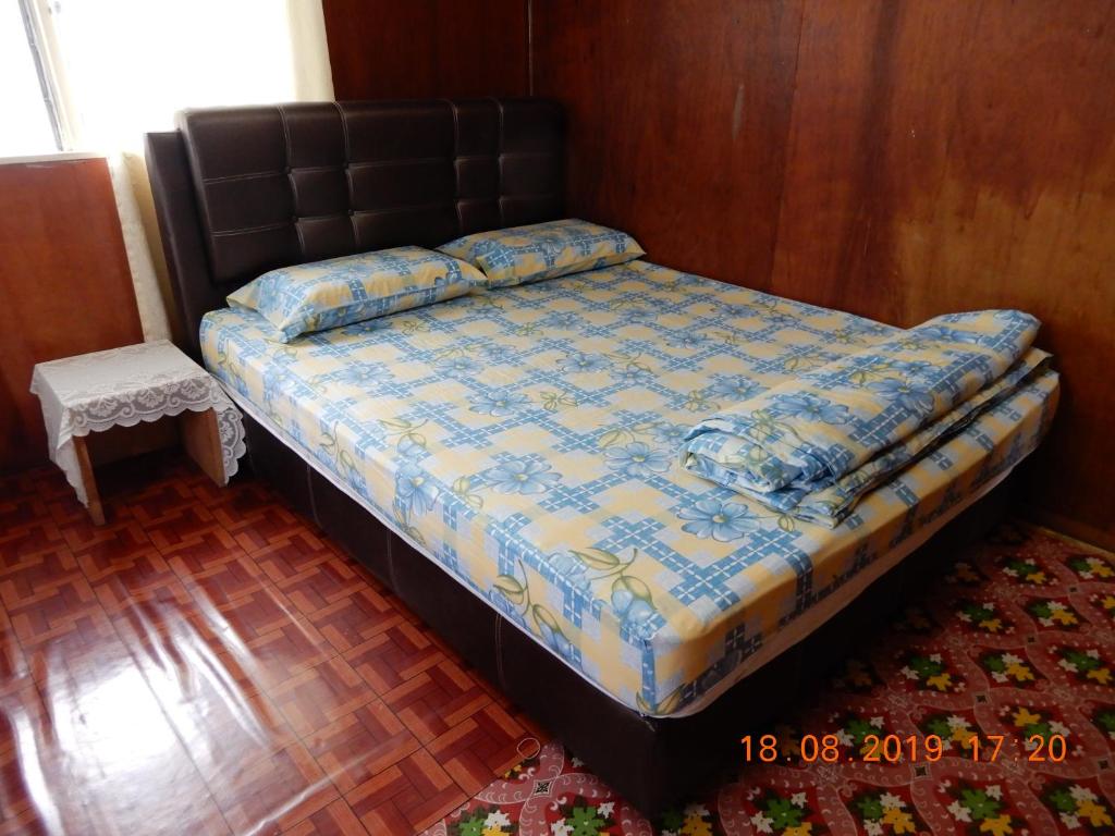 Postel nebo postele na pokoji v ubytování Bulan And Daud Homestay