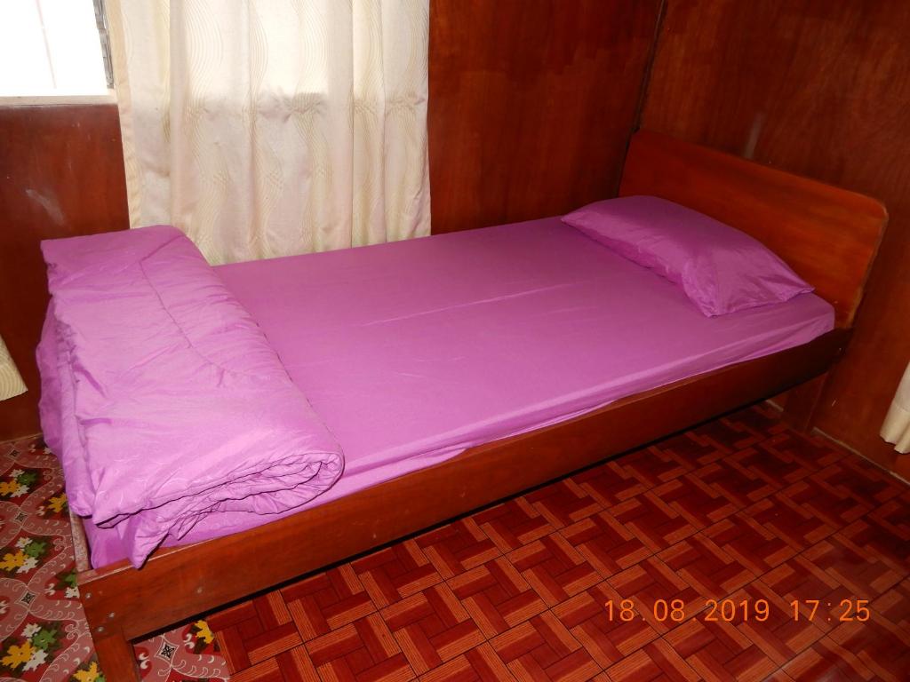 Postel nebo postele na pokoji v ubytování Bulan And Daud Homestay