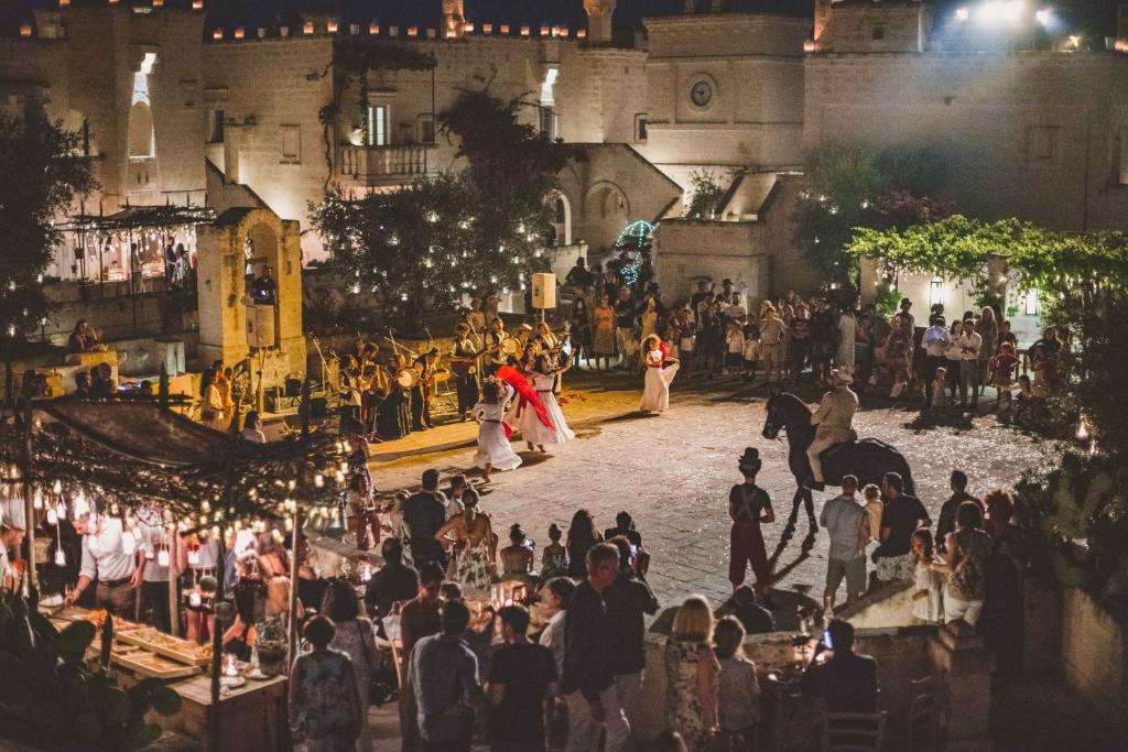 a group of people standing in front of a building at Borgo Egnazia in Savelletri di Fasano