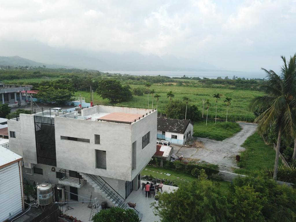 an aerial view of a white building and a field at Taitung Jia Lulan Tribal in Taitung City