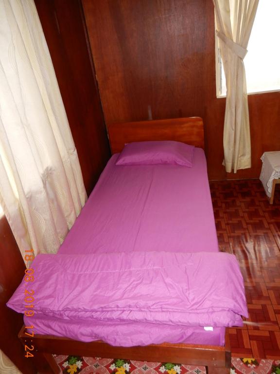 Postel nebo postele na pokoji v ubytování Bulan And Daud Homestay