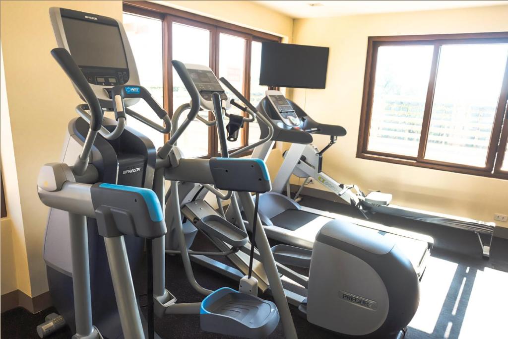 a gym with several tread machines in a room at The Piccolo Hotel of Boracay in Boracay