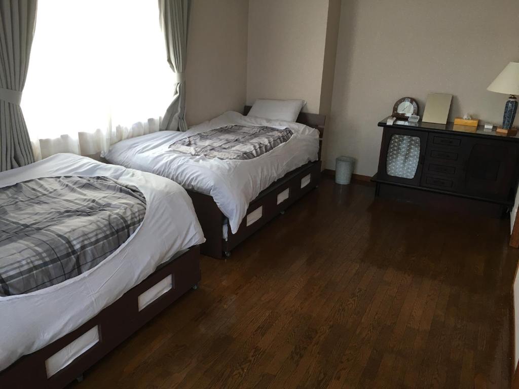 Postel nebo postele na pokoji v ubytování Hostel Mallika