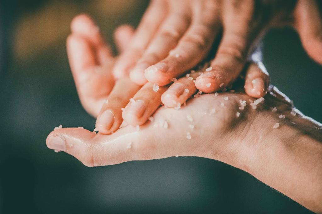 a person washing their hands with water at Borgo Egnazia in Savelletri di Fasano