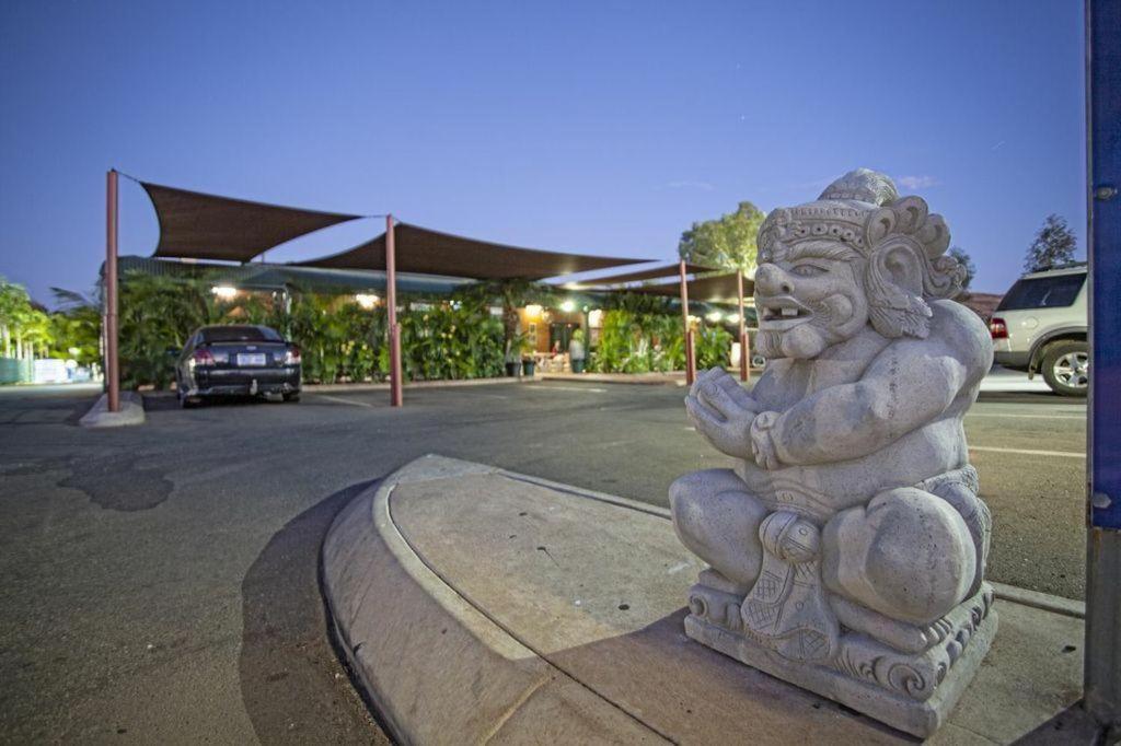 a statue sitting on the side of a street at Latitude20 Cattrall Park Motel in Karratha