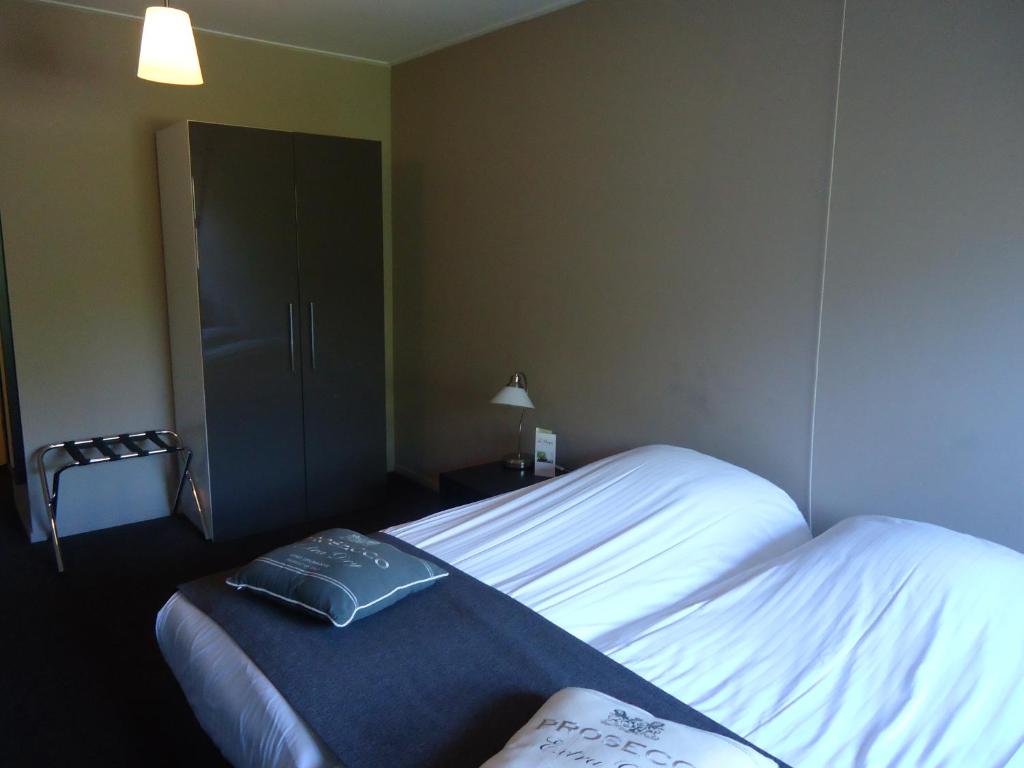 Postel nebo postele na pokoji v ubytování Hotel en Restaurant de Stripe