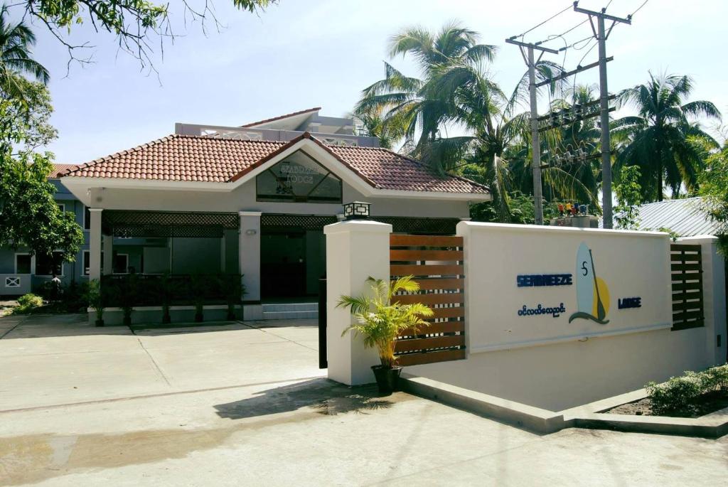 a house with a banana sign in front of it at Sea Breeze Lodge Ngapali in Ngapali