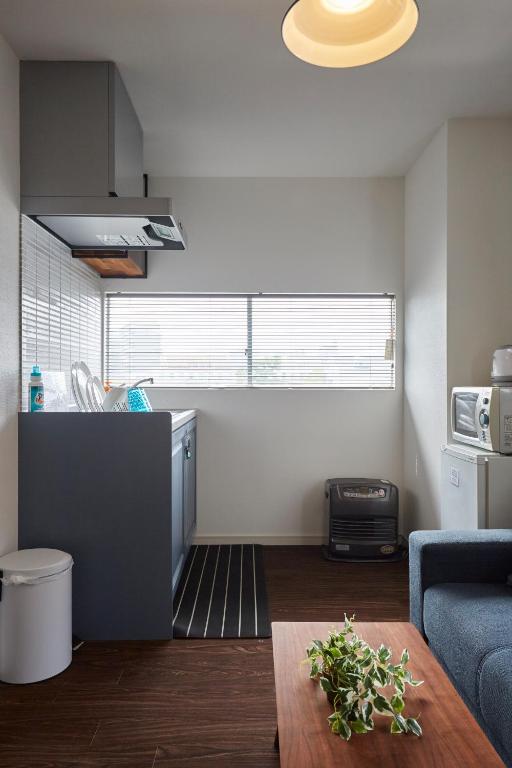 Kuchyň nebo kuchyňský kout v ubytování Hostel Cuore Kurashiki