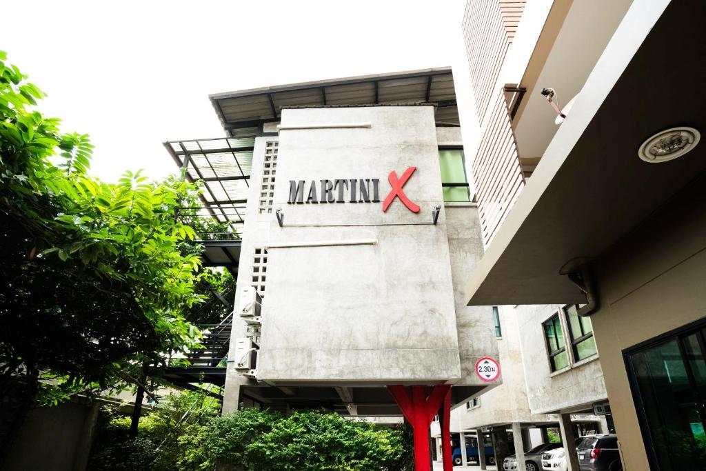 a building with a marmite sign on the side of it at Matini Ratchada 32 in Bangkok