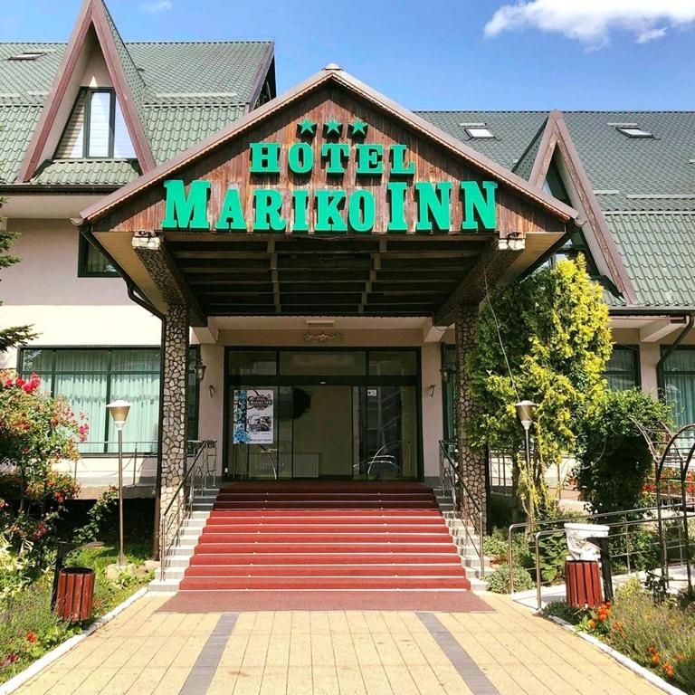 a hotel maruation sign on the front of a building at Hotel Mariko Inn in Roman