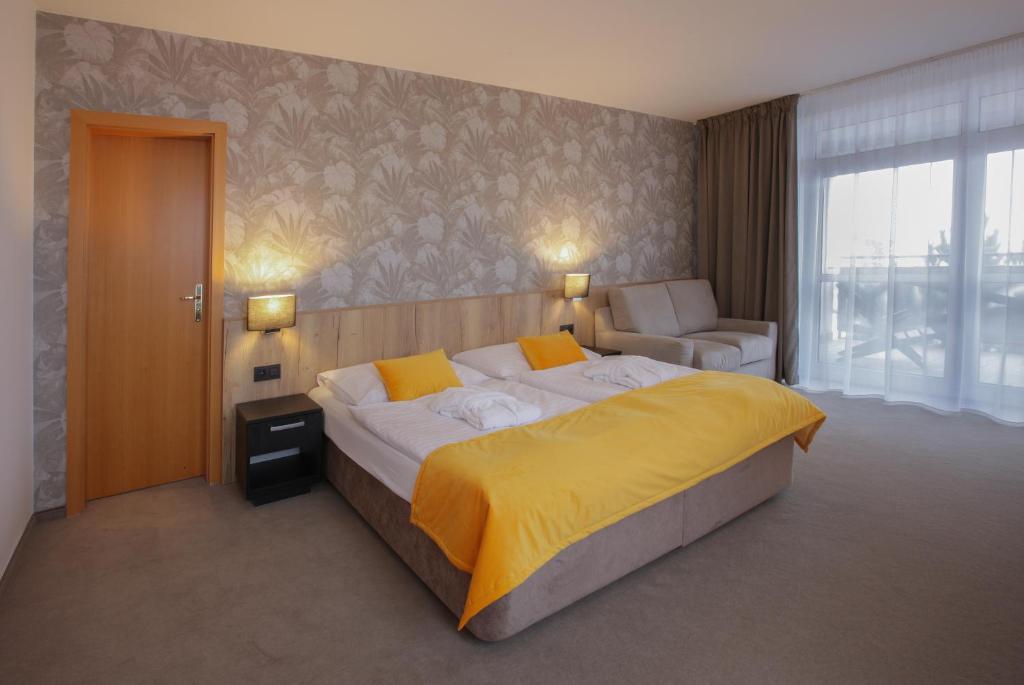 Voodi või voodid majutusasutuse Rodinný Hotel Hubert High Tatras toas