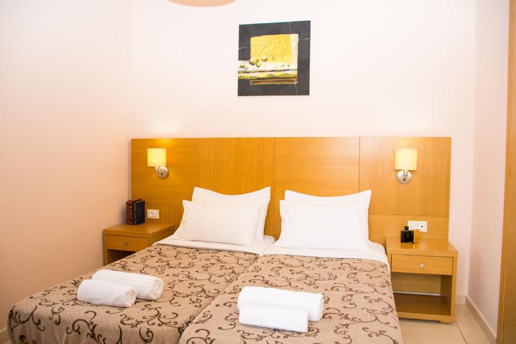 A bed or beds in a room at Marigianna Apartments