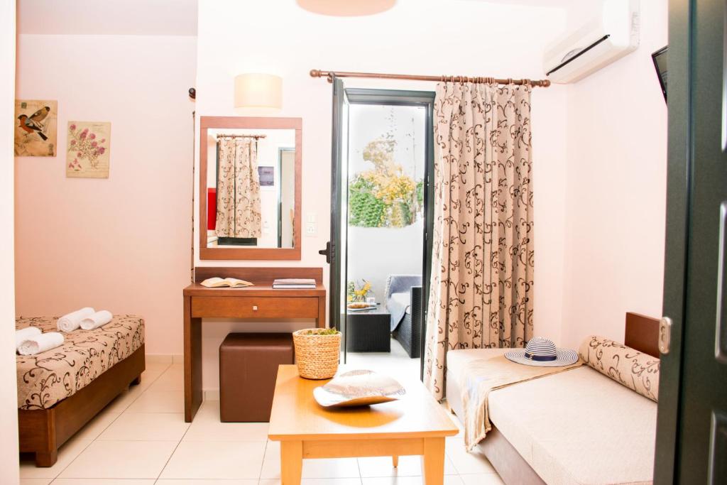 A bed or beds in a room at Marigianna Apartments