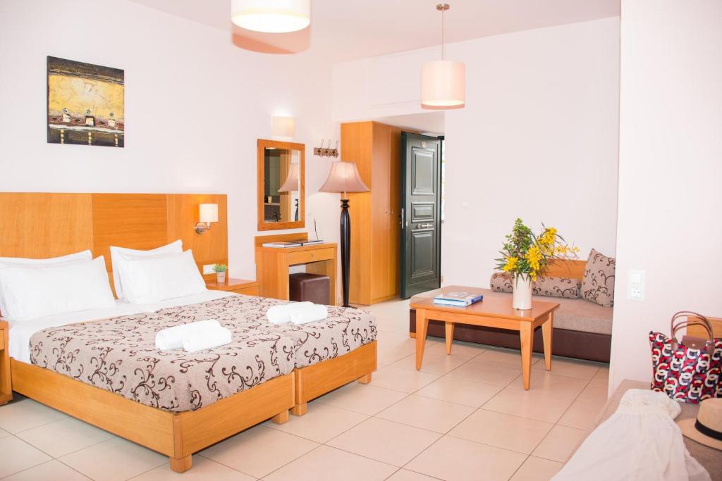 A bed or beds in a room at Marigianna Apartments