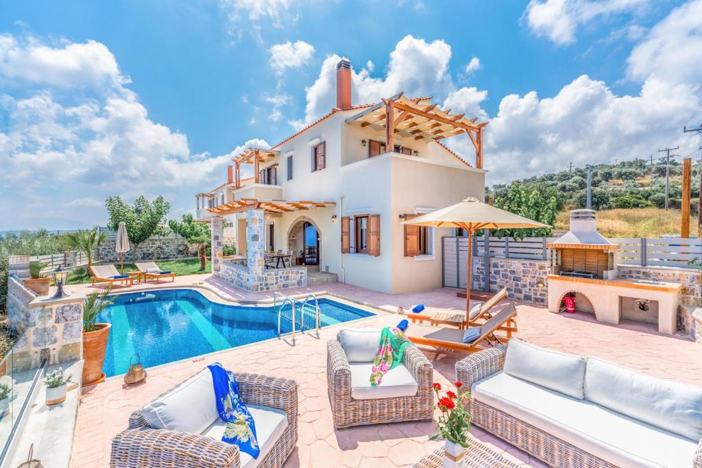 a villa with a swimming pool and a house at New Villa Kantifes 4 Families or Couples with Private Pool & BBQ in Kiriánna