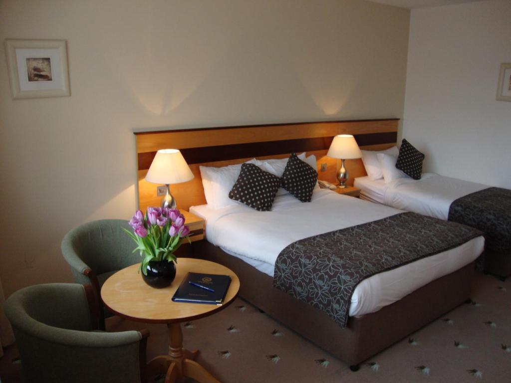 Postel nebo postele na pokoji v ubytování Ard Ri House Hotel