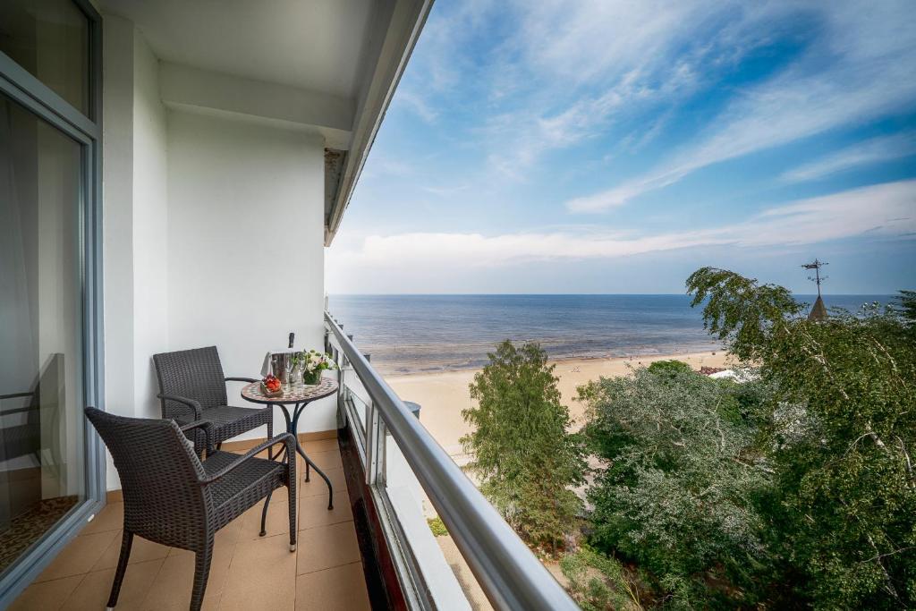a balcony with a view of the beach at Baltic Beach Hotel & SPA in Jūrmala