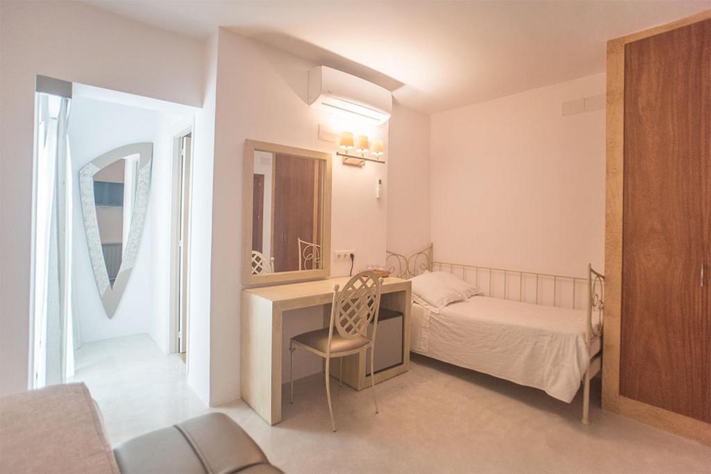 Postel nebo postele na pokoji v ubytování Hotel Sa Volta