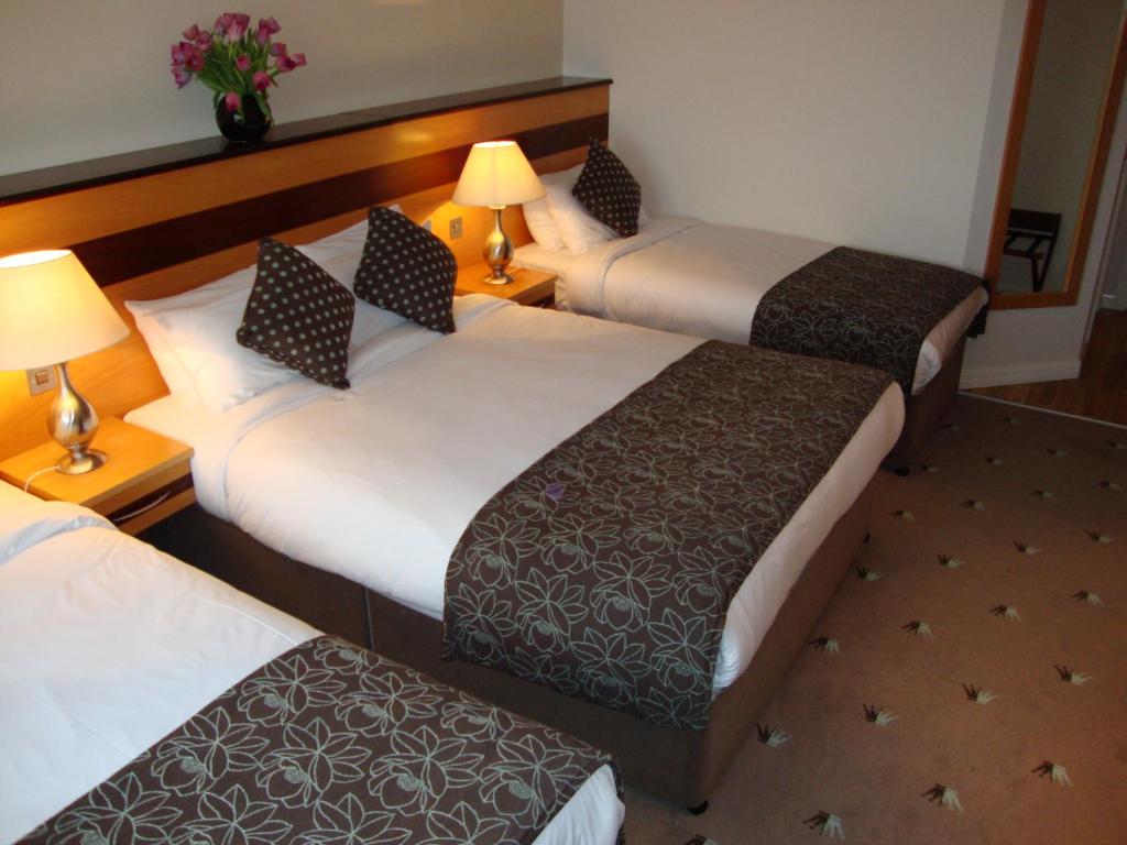Postel nebo postele na pokoji v ubytování Ard Ri House Hotel