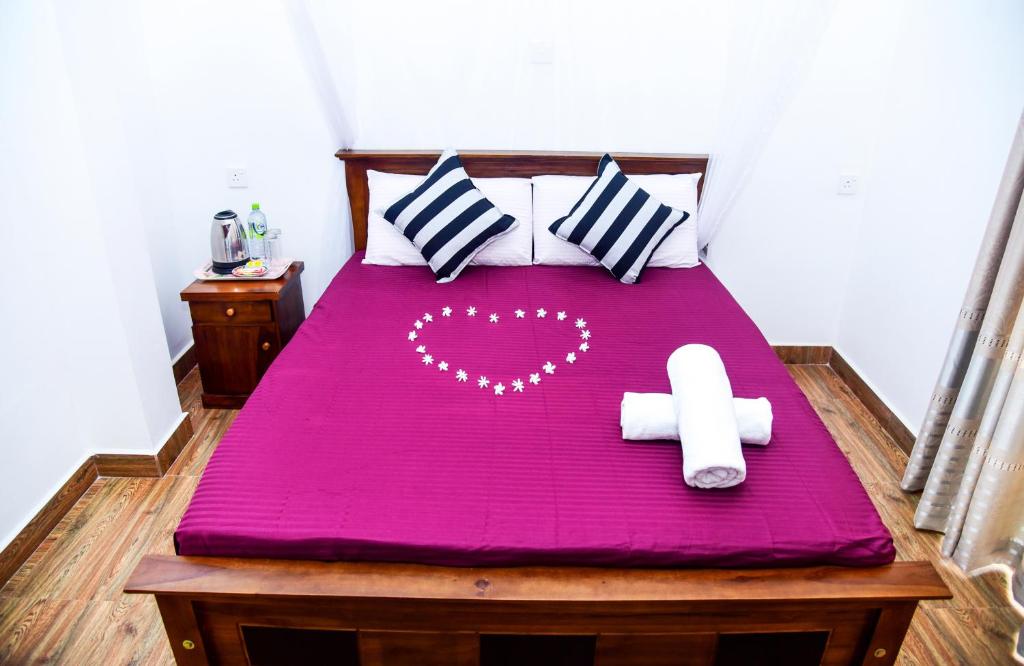 Postel nebo postele na pokoji v ubytování Gems Moon Paradise