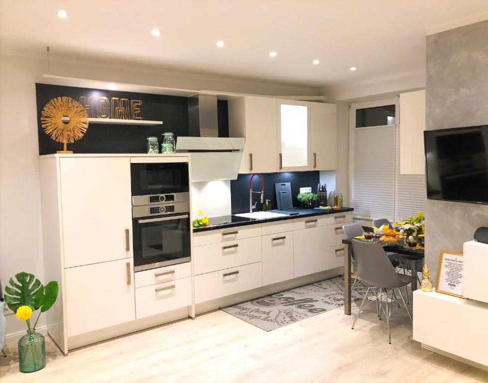 Kuchyň nebo kuchyňský kout v ubytování Ferienwohnung Domizil am Delft Emden