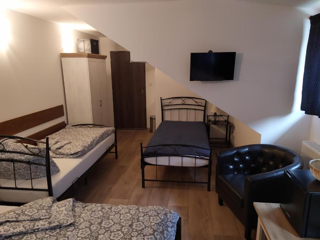 Postel nebo postele na pokoji v ubytování Penzion a restaurace U Kalendů
