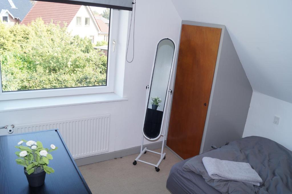 Postel nebo postele na pokoji v ubytování Kongebrogade 77