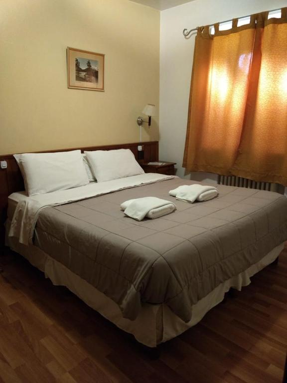 Postel nebo postele na pokoji v ubytování Hosteria La Pastorella