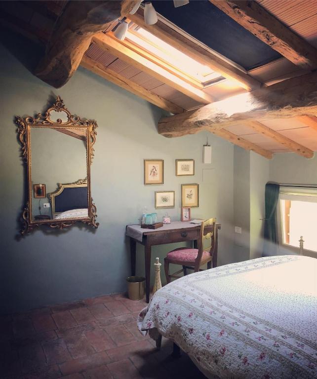 Postel nebo postele na pokoji v ubytování B&B Podere Merlo