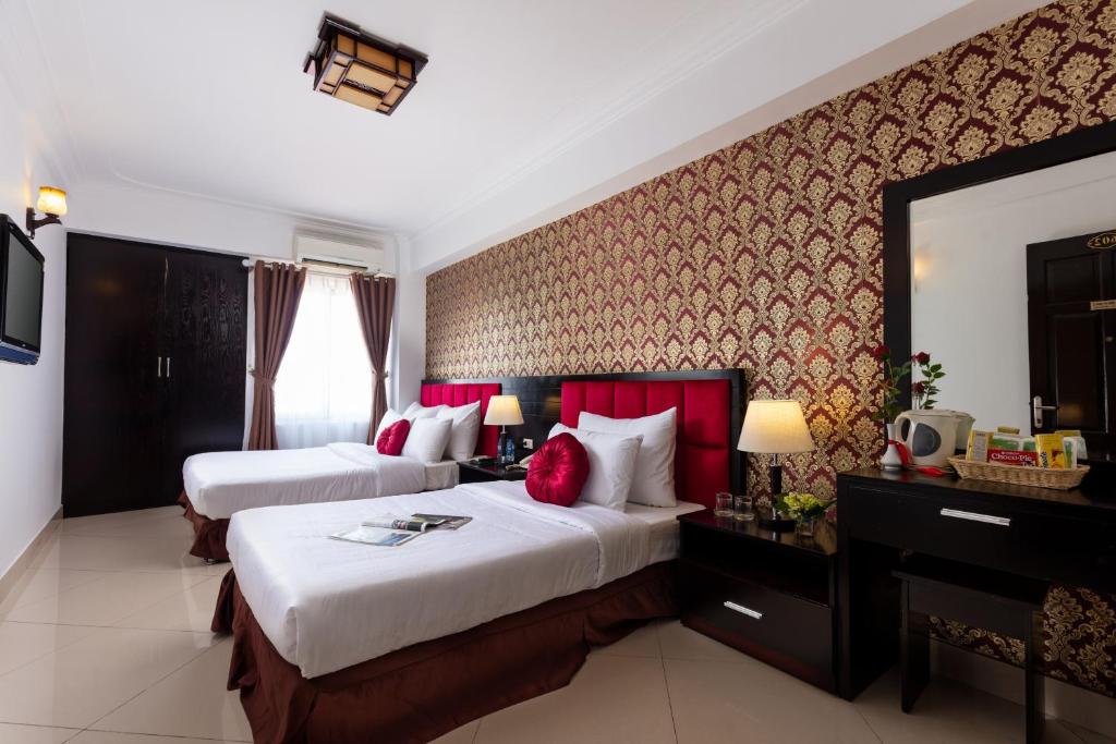 Postel nebo postele na pokoji v ubytování Hanoi Amore Hotel & Travel