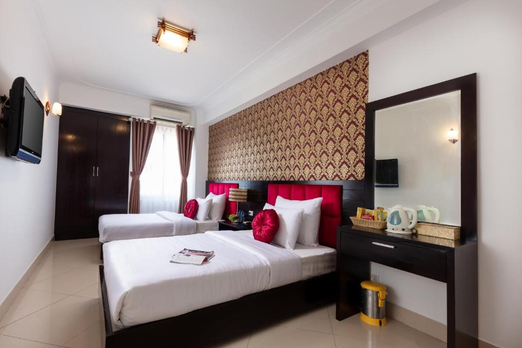 Postel nebo postele na pokoji v ubytování Hanoi Amore Hotel & Travel