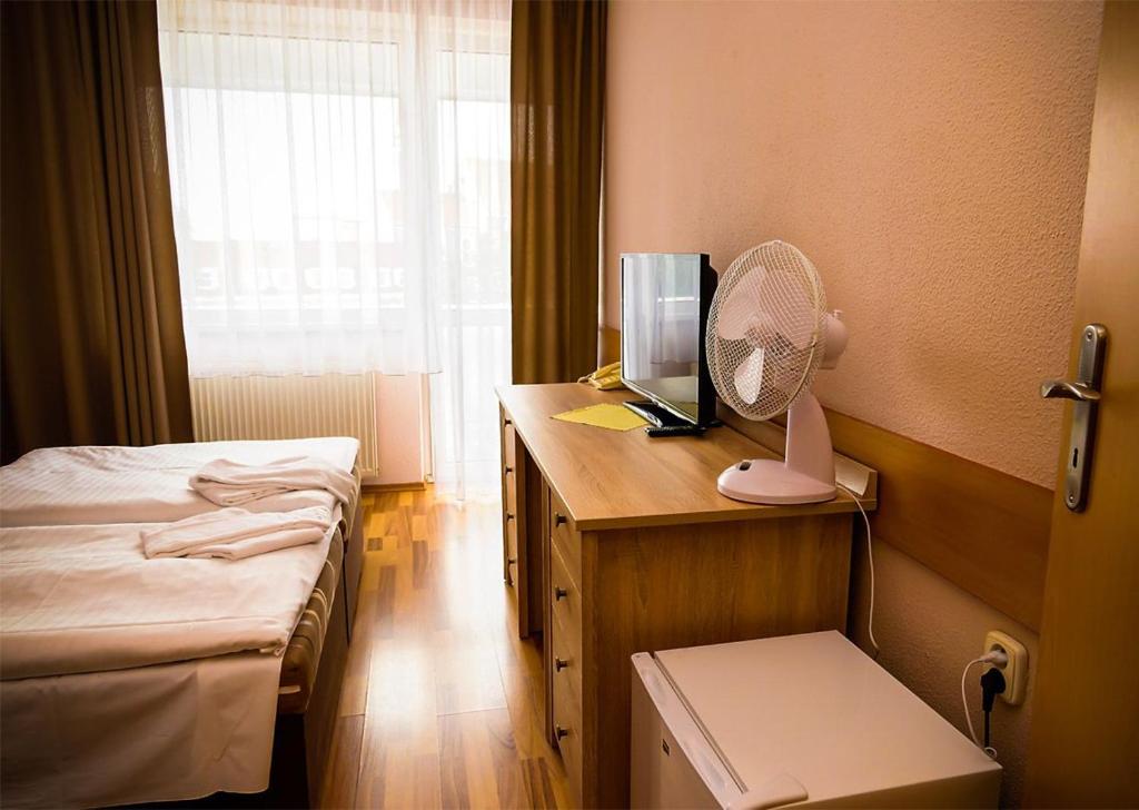 Postel nebo postele na pokoji v ubytování Hotel Atrium