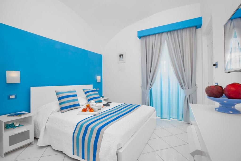 Postel nebo postele na pokoji v ubytování Villa Vittoria
