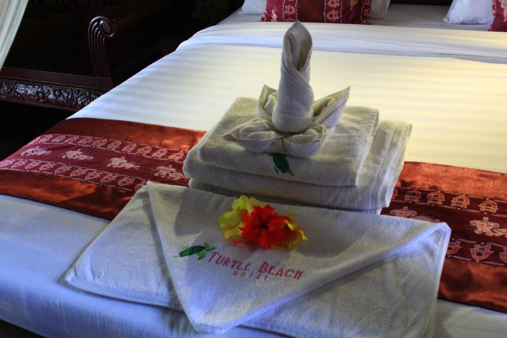 Postel nebo postele na pokoji v ubytování Turtle Beach Hotel