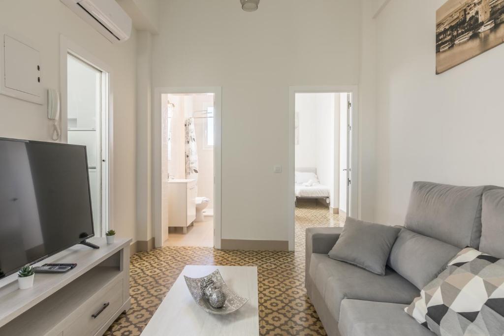 A television and/or entertainment centre at AoA San Lorenzo Apartment