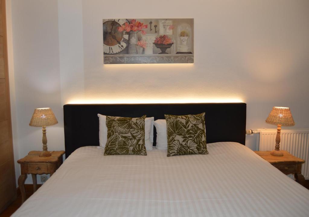 Postel nebo postele na pokoji v ubytování Hotel Côté Cour