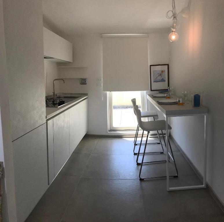 Kuchyň nebo kuchyňský kout v ubytování Attico Belvedere
