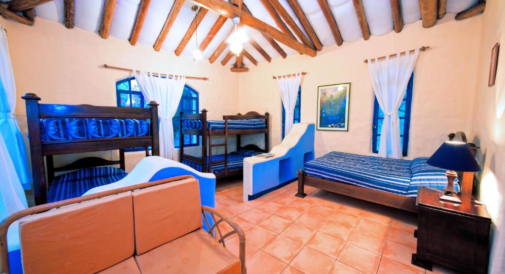 Postel nebo postele na pokoji v ubytování Mantaraya Lodge