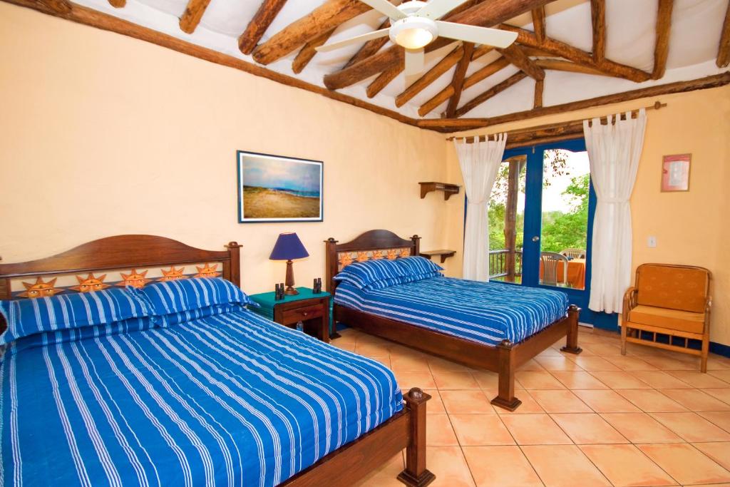 Postel nebo postele na pokoji v ubytování Mantaraya Lodge