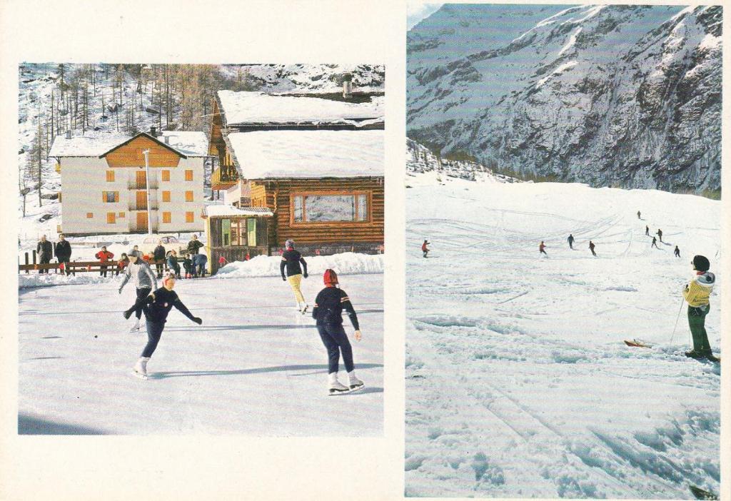 a group of people skiing down a snow covered slope at Monte Rosa Ski Apartment in Gressoney-Saint-Jean