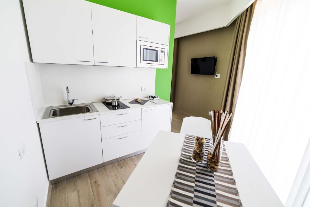 Kuchyň nebo kuchyňský kout v ubytování Vignadonica Resort