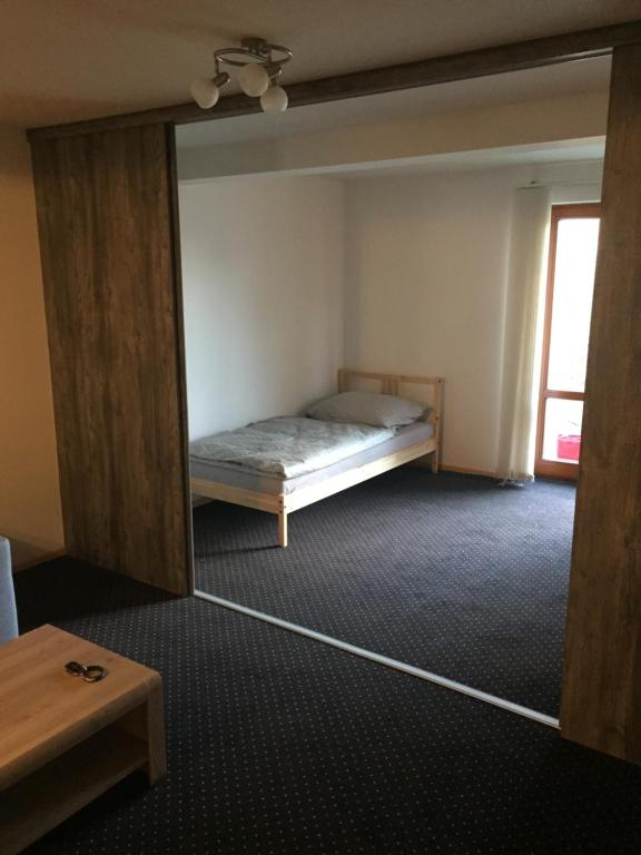 Letto o letti in una camera di Apartmány Mariánská