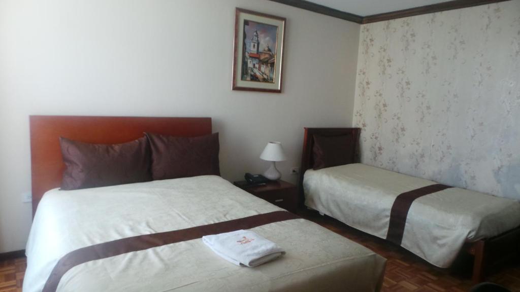 Postel nebo postele na pokoji v ubytování Hotel Villa Lafayette