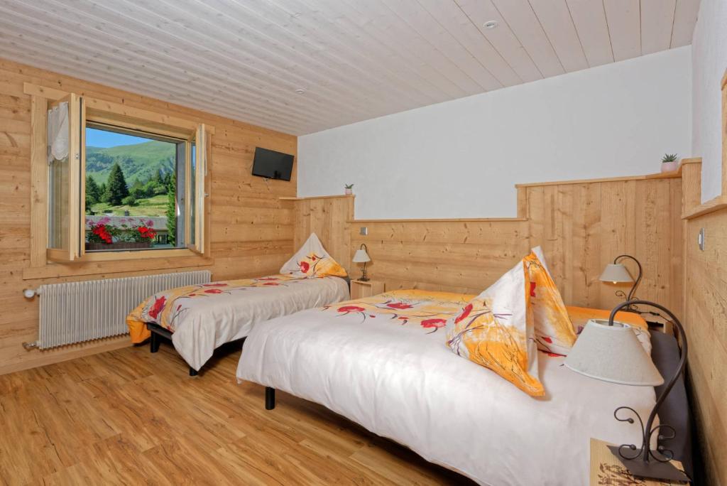 Postel nebo postele na pokoji v ubytování Au Bivouac de Napoléon et Spa